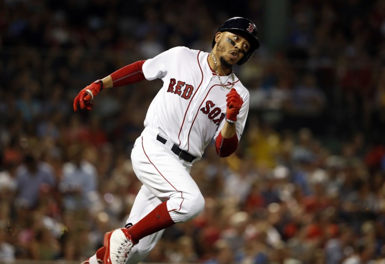 Boston's Mookie Betts runs out a double against the Texas Rangers in the fifth inning Tuesday night in Boston.