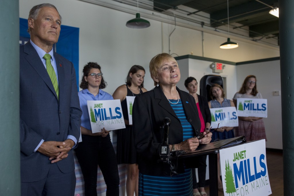 Maine Attorney General and Democratic gubernatorial candidate Janet Mills is joined Thursday by Washington Gov. Jay Inslee, left, chairman of the Democratic Governors Association, at a campaign event in which they spoke about the benefits of expanding Medicaid, which Inslee said had been part of his state's "comprehensive success" in reforming health care.