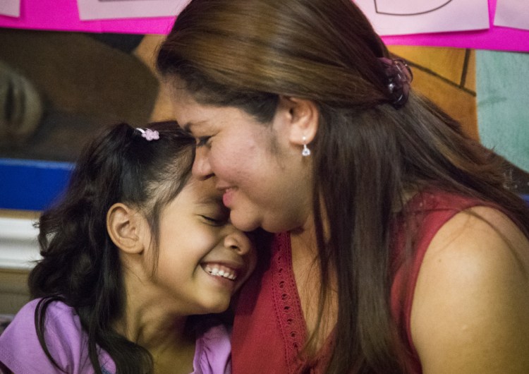 Alison Madrid, 6, and her mother, Cindy, who were separated at the U.S.-Mexico border in June, embrace after being reunited Friday in Houston.