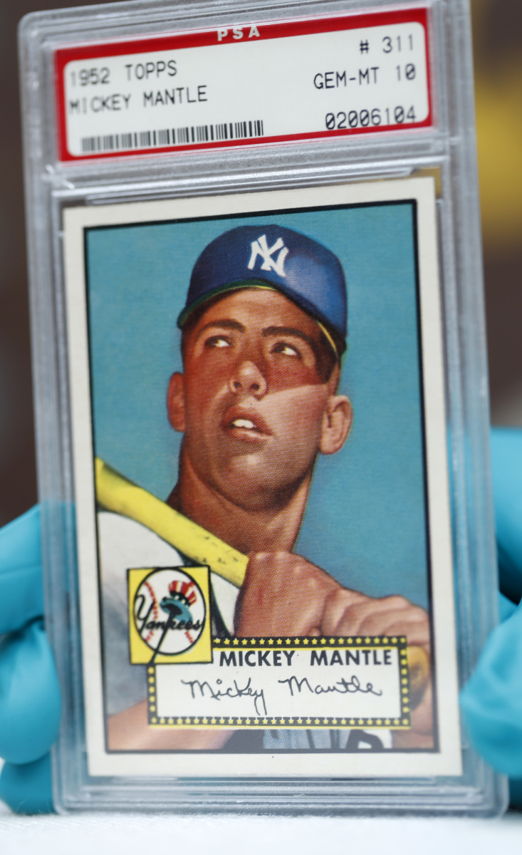 The "Holy Grail" of baseball cards, a 1952 Topps Mickey Mantle, is valued at millions of dollars. One of the three with a gem mint rating will be on display in Denver.