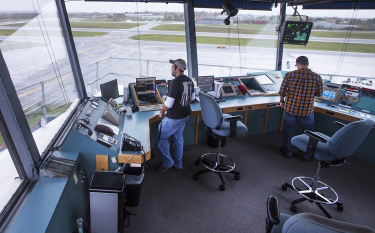 The 25 air traffic controllers in Portland who are members of the National Air Traffic Controllers Organization will continue to work despite the lack of pay. Controllers are shown at work in July.
