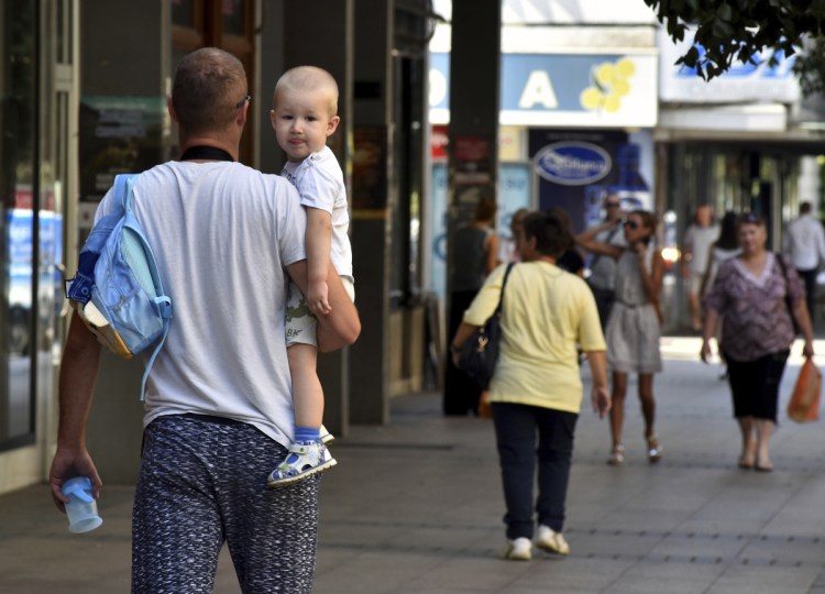 People walk trough the street in Montenegro's capital Podgorica on Thursday.