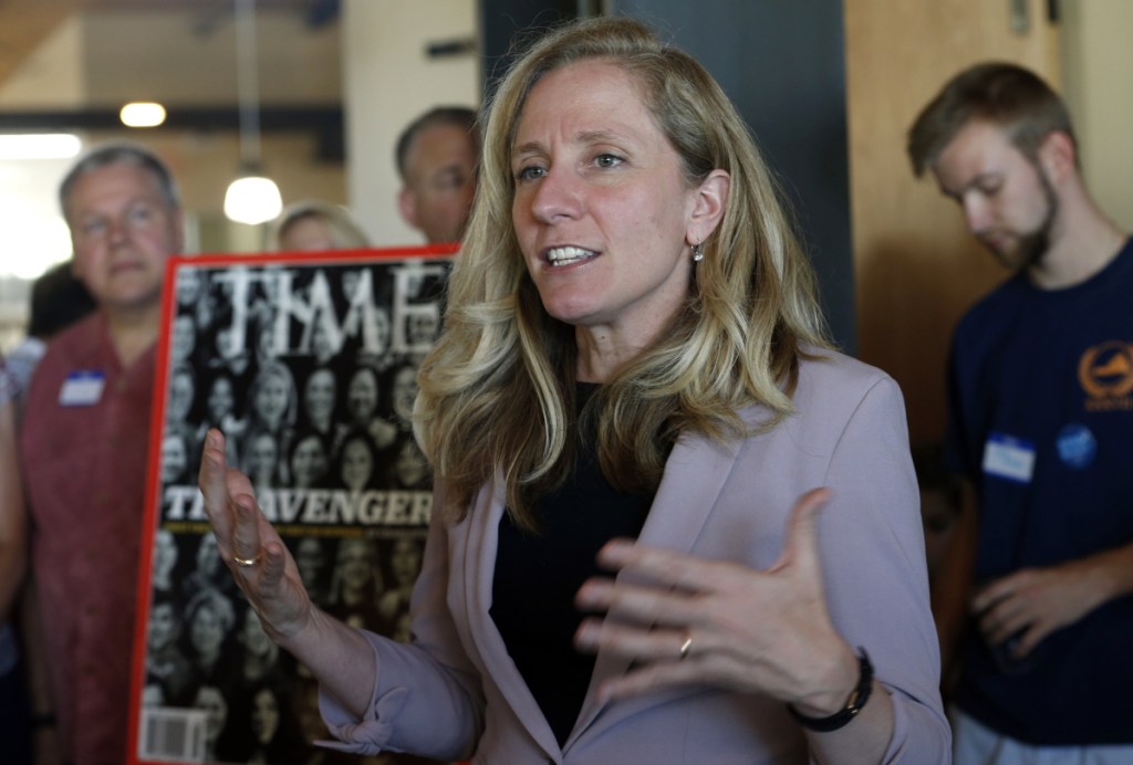 Former CIA officer and Democratic candidate for the 7th district Congressional seat, Abigail Spanberger, center, speaks to supporters at a rally in Richmond, Va., on Wednesday.  Opposition to President Donald Trump is changing the political map for Democrats who find themselves riding a wave of anti-Trump energy to compete in areas they once left for lost.