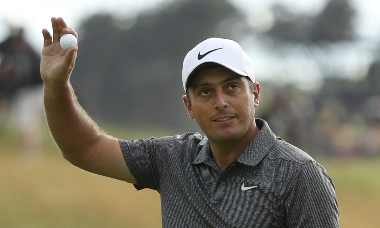 Francesco Molinari celebrates on the 18th hole after the final round for the 147th British Open Golf on Sunday in Carnoustie, Scotland. Molinari finished 8-under par to win the tournament by two shots.