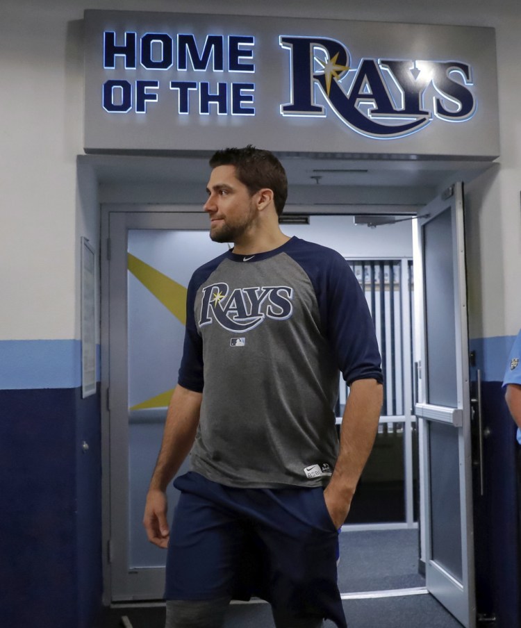 Nathan Eovaldi emerges from the Tampa Bay Rays' clubhouse after being traded to the Boston Red Sox on Wednesday. (AP Photo/Mike Carlson)