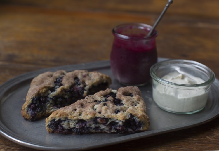 Blueberry scones made with frozen wild Maine blueberries and served with blueberry curd and vanilla crème fraiche.
