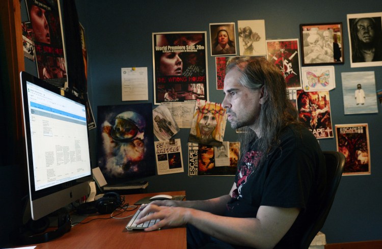 Shawn French, video game writer, comic book writer and movie maker, works on a video game at his Limerick home.