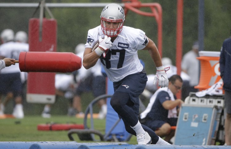 Tight end Rob Gronkowski appears ready for the regular season Thursday during an agility drill as the New England Patriots open training camp in pursuit of their sixth Super Bowl championship during the Bill Belichick-Tom Brady era.