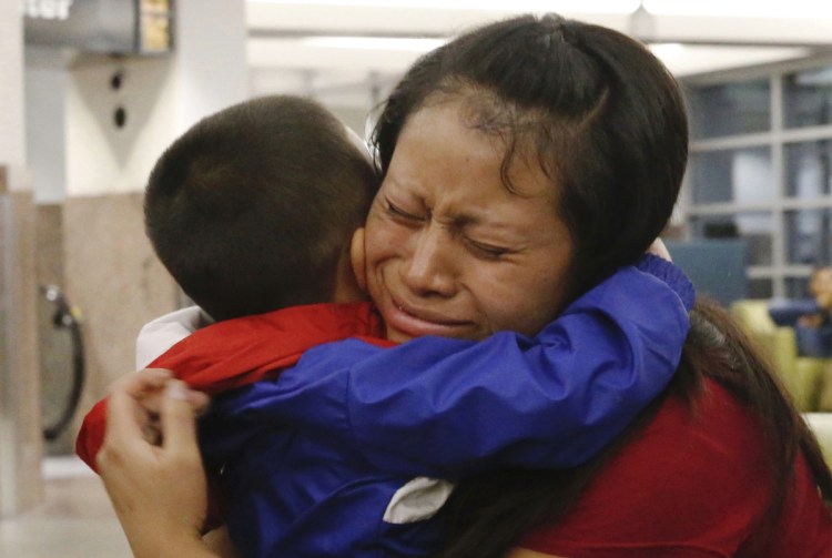 Maria holds her 4-year-old son Franco after he arrived at the El Paso International Airport on July 26. The two had been separated for over six weeks.