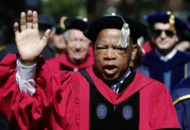 Rep. John Lewis walks in a procession during Harvard University commencement exercises in Cambridge, Mass. The civil rights icon has been hospitalized for undisclosed reasons Saturday. Citing a statement from Lewis' office, WSB-TV reports that the 78-year-old Georgia congressman was "resting comfortably" in a hospital for "routine observation." The statement says Lewis expects to be released Sunday.