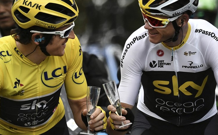 Geraint Thomas, left, wearing the overall leader's yellow jersey and teammate Christopher Froome toast with during the 21st and last stage of the 105th edition of the Tour de France on Sunday between Houilles and Paris Champs-Elysees.