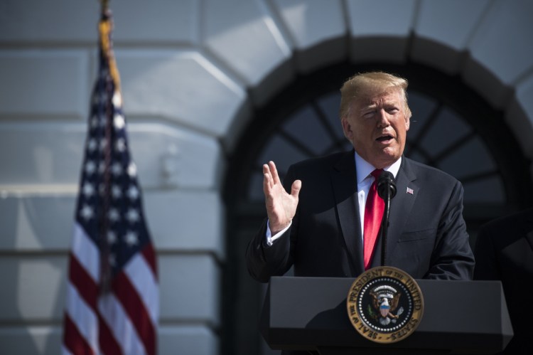 President Trump speaks about the economy on the South Lawn of the White House on Friday. He unleashed a Twitter tirade Sunday after the New York Times' publisher revealed details of a July 20 meeting between the two. 