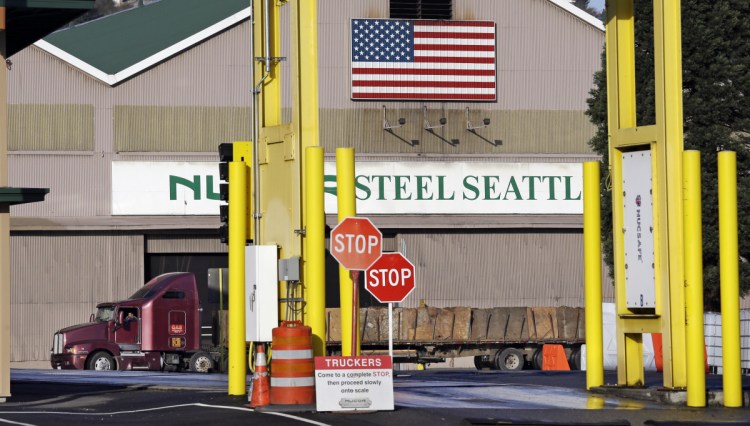 A truck carries a load at the Nucor Steel plant in Seattle. U.S. companies pursuing exemptions from President Trump's tariff on imported steel are accusing American steel manufacturers of spreading inaccurate and misleading information, and they fear it may torpedo their requests. 