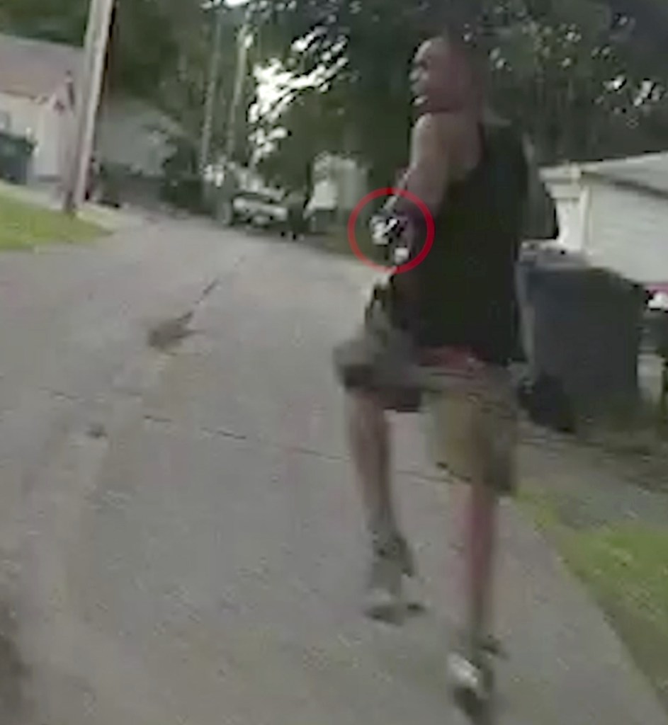 A police cam image shows Thurman Blevins running from officers on June 23. The red circle delineates what is purported to be a gun in his hand.
