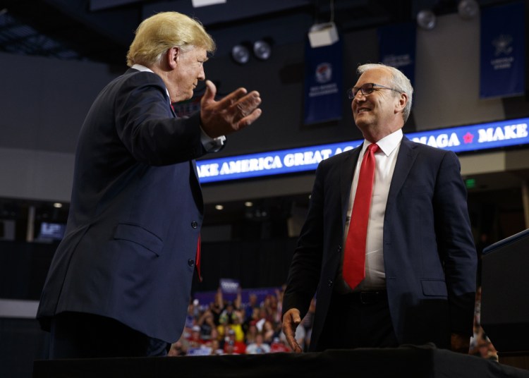 President Trump hugs Senate candidate Rep. Kevin Cramer, R-N.D., during a campaign rally in Fargo, N.D. on June 27. The conservative Koch brothers' network declared July 30, that it will not fund Cramer, the Republican Senate candidate in North Dakota, turning its back on the GOP in a marquee election — at least for now — after determining that the Republican challenger is no better than the Democratic incumbent Heidi Heitkamp.