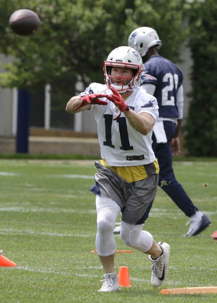 New England Patriots wide receiver Julian Edelman (11) catches a pass during practice back on June 7 in Foxborough, Massachusetts.