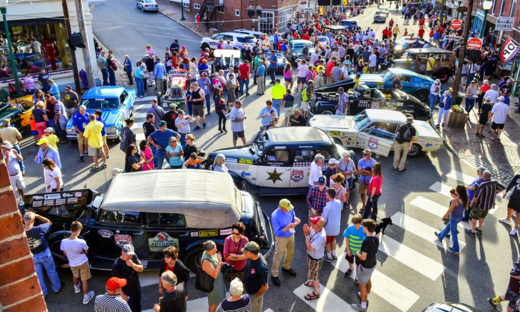 People check out Great Race vehicles on display June 26 at the intersection of Water and Church streets in Gardiner.