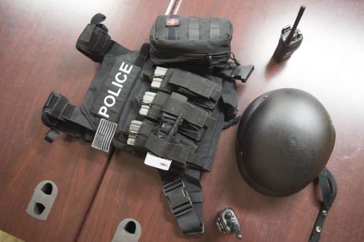 Fairfield police display a new tactical vest, helmet and radios Friday at the police station.