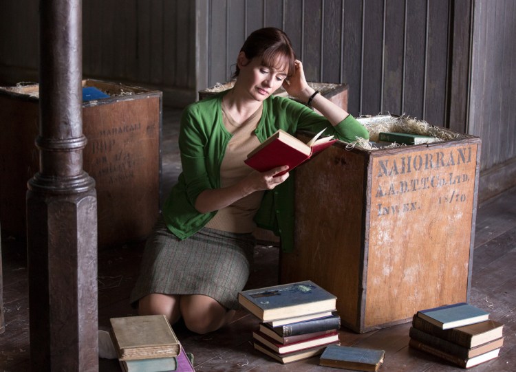 Bookshop owner Florence Green (Emily Mortimer) gets lost in one of her products in the "The Bookshop."