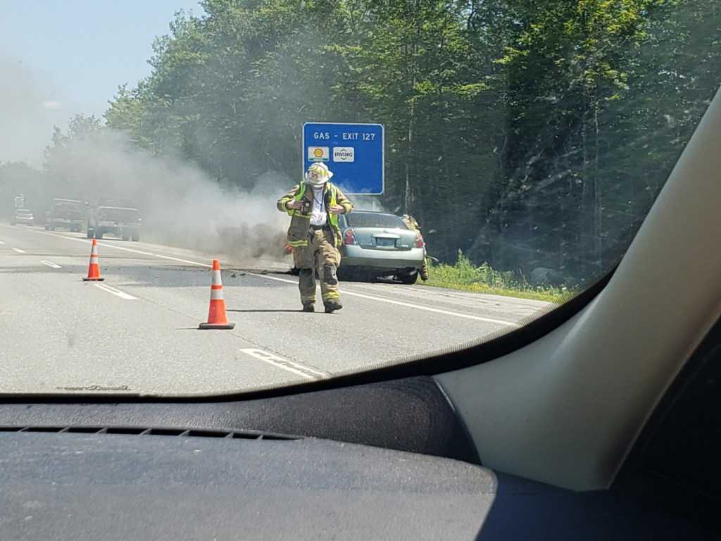 Waterville firefighters put out a fire that engulfed the engine of a car Friday in the northbound lanes of Interstate 95 near exit 27.