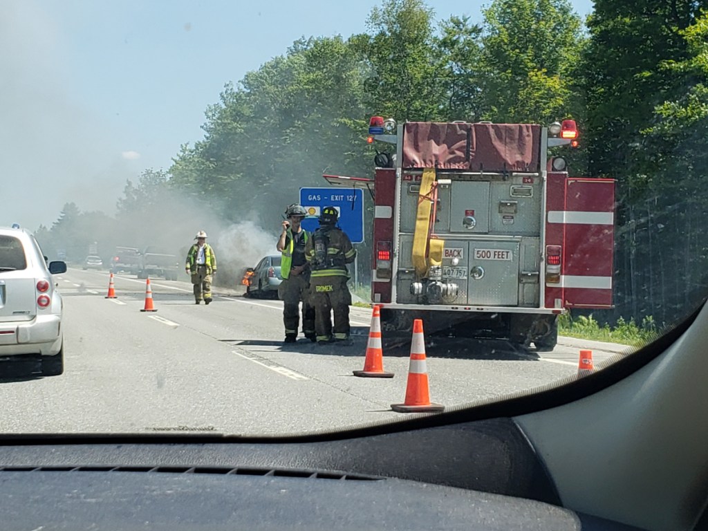 Waterville firefighters put out a fire that engulfed the engine of a car Friday in the northbound lanes of Interstate 95 near exit 27.