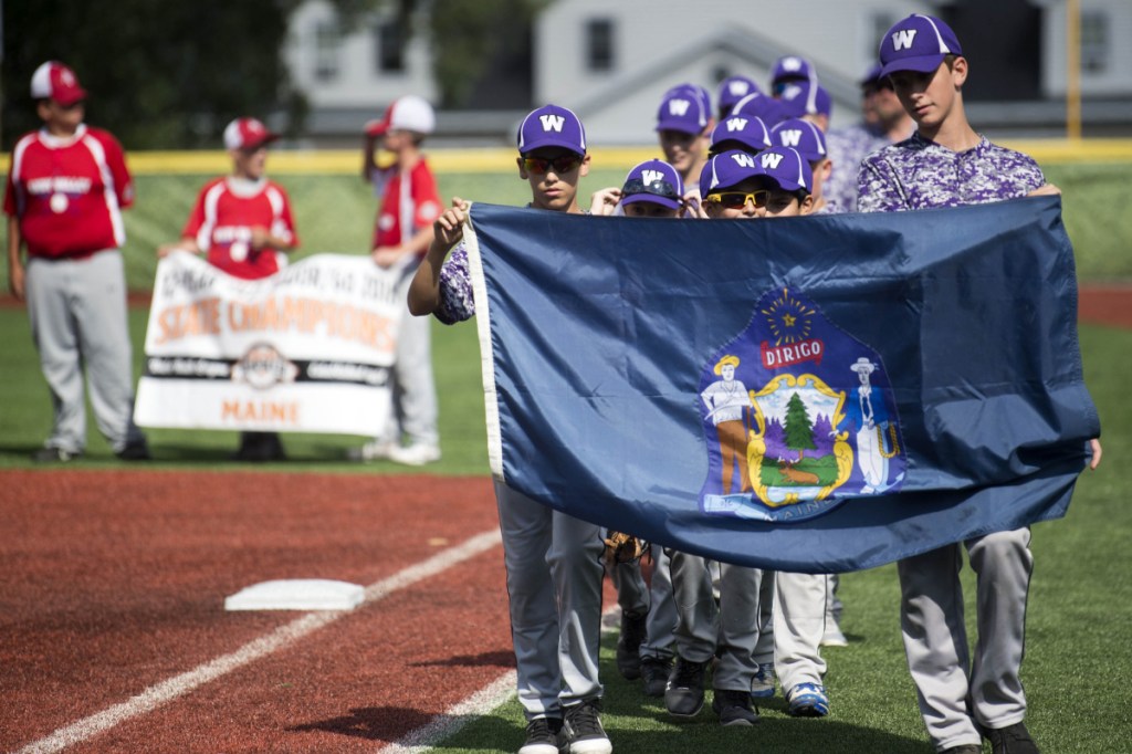 The Waterville baseball team marches onto the field for opening ceremonies for the Cal Ripken 12U New England regional tournament Friday at Purnell Wrigley Field in Waterville.