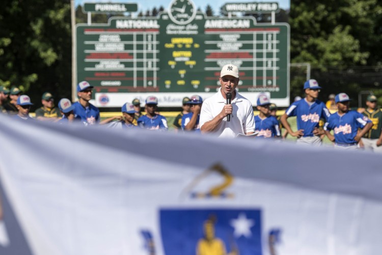 Staff photo by Michael G. Seamans 
 Ken Walsh introduces Stump Merrill during opening ceremonies for the Cal Ripken 12U New England regional tournament Friday at Purnell Wrigley Field in Waterville.