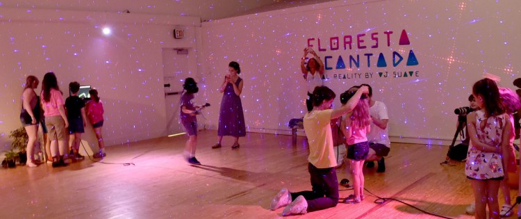 Ygor Marotta, center, of VJ Suave helps a child with a Tilt Brush virtual reality drawing device in a workshop on the art of digital creation, a MIFFONEDGE event at the Maine International Film Festival in Waterville on Monday.