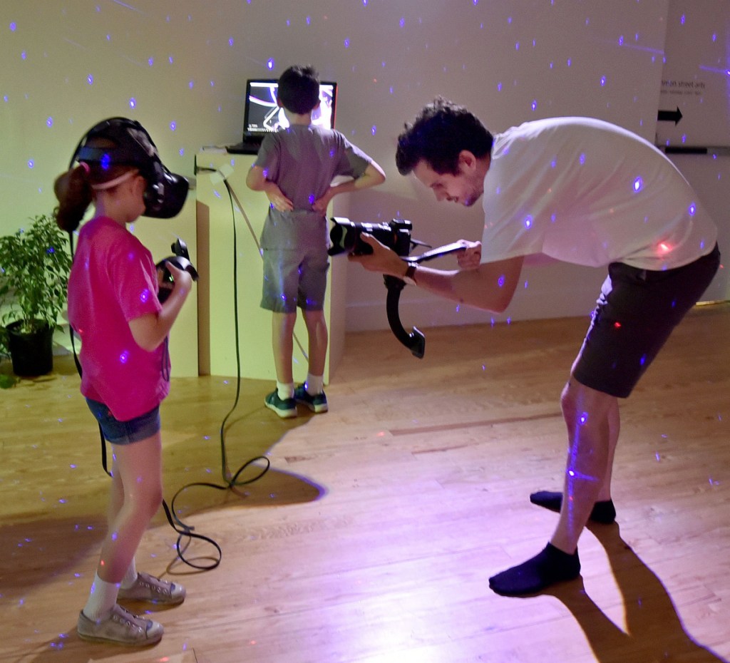 Penelope Graham uses a Tilt Brush virtual reality drawing device in a workshop on the art of digital creation, a MIFFONEDGE event at the Maine International Film Festival in Waterville on Monday. Wesley Steers films her.