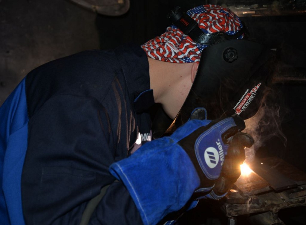 Bryson Dostie, a Lawrence High School student, works on his welding project at the Welding and Fabrication Day Camp at Kennebec Valley Community College.