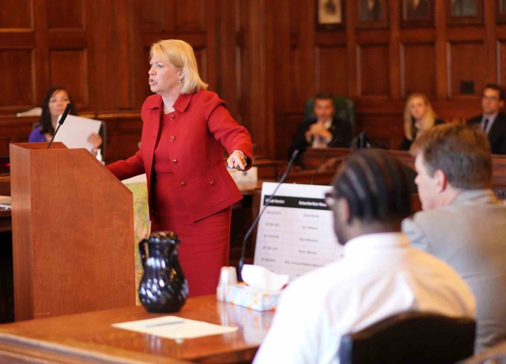 Lisa Marchese, deputy attorney general, addresses the jury during closing arguments Wednesday in the murder trial of David W. Marble Jr. at the Cumberland County Courthouse in Portland. Marble, seen in the foreground, is on trial for two murder charges stemming from the Dec. 25, 2015, shooting deaths of Eric Williams and Bonnie Royer.