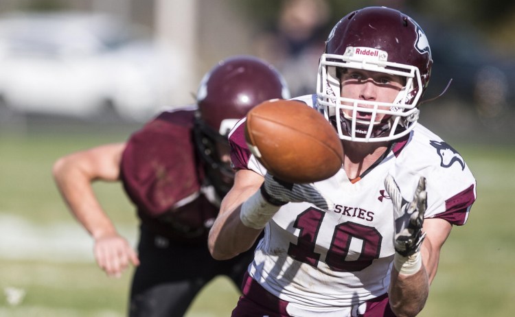 Maine Central Institute's David Young eyes the ball in to his hands for the reception against Nokomis High School in Newport last fall. He will play in the Maine Shrine Lobster Bowl this weekend.