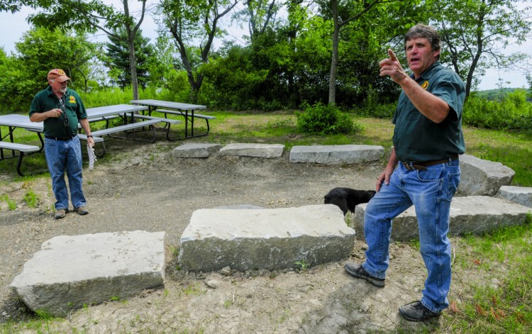 Youth Program Coordinator Mark Goodridge, left, and Executive Director David Trahan give a tour of the new Sportsman's Alliance of Maine outdoor area on July 14 in Augusta.