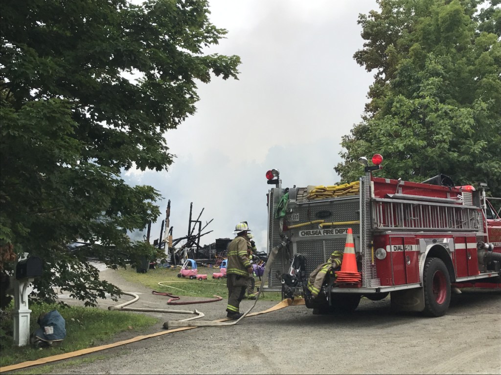 Firefighters battle a blaze Monday morning that destroyed a house on Hillcrest Drive in Chelsea.