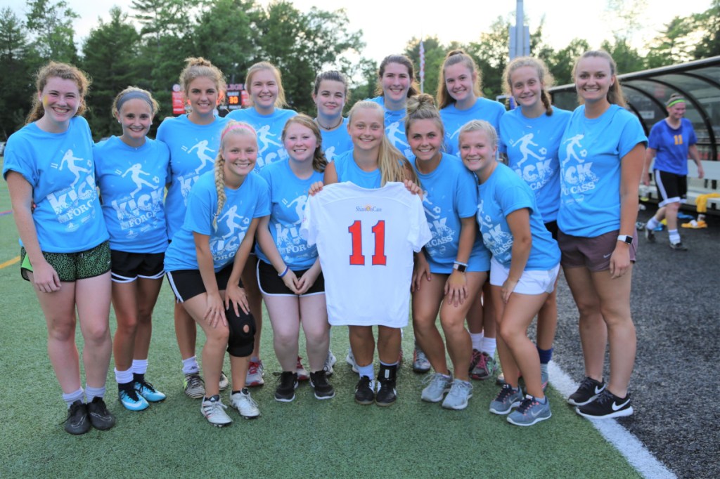 Cassidy Charette's former teammates from Messalonskee High School carry Cassidy's #11 jersey during the final game at the 11-hour Kick Around the Clock for Cass event July 15 at Thomas College. Front, from left, are Katie Mercier, Jess Charrier, Fern Calkins, Lauren Picket and Lauren Mercier. Back from left are Ella Moore, Amelia Bradfield, Elena Guarino, Taylor Easler, Gaby Languet, McKenna Brodeur, Makenzie Charest, Olivia Lagace and Dakota Bragg.