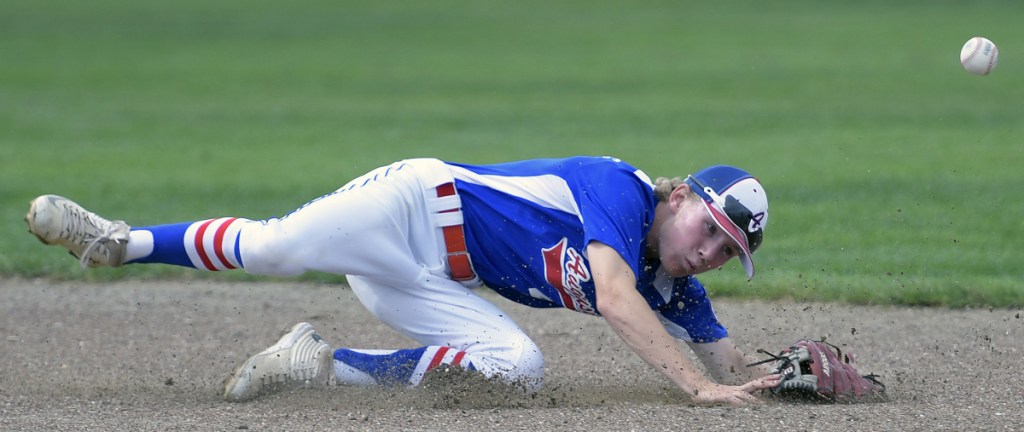 Augusta's Ian Stebbins can't stop the ball at second base against Tri-County during the 13-15 New England Regional Babe Ruth tournament Monday in Augusta.
