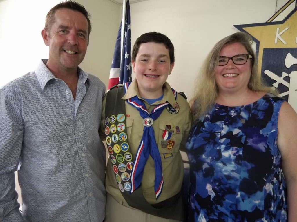 Eagle Scout Eric McDonnell, center, and his parents Patrick, left, and Audrey McDonnell of Augusta