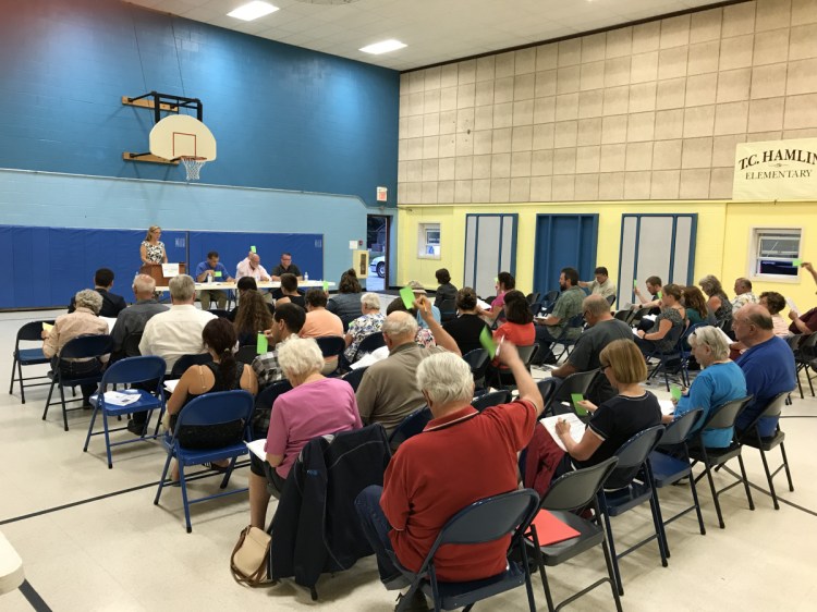 Residents vote on budget items Wednesday night at the Randolph Town Meeting.