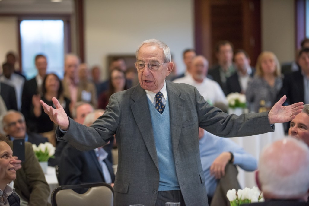 John "Swisher" Mitchell raises his arms during an April 2017 ceremony at Colby College in which the school announced the creation of the John "Swisher" Mitchell Assistant Coach for the men's basketball program. It was the first endowed assistant coaching position in the New England Small College Athletic Conference. Mitchell died Wednesday. He was 91.