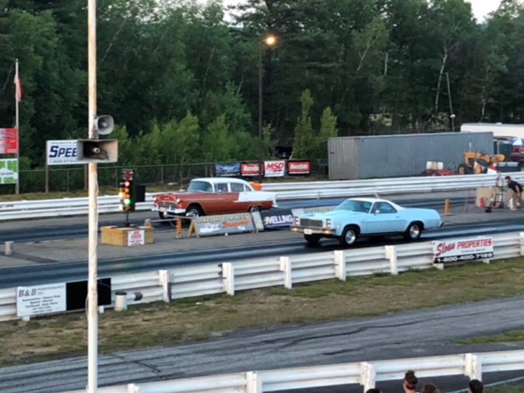A pair of cars launch off the starting line at Oxford Plains Dragway on Route 26 in Oxford during a Friday night program at the track.