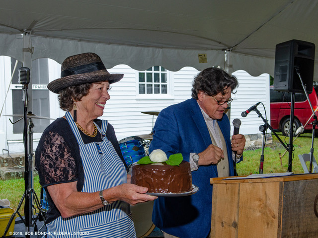 Wendy Ross Eichler displays a "Two in One Dessert," that sold for a record-breaking $1,000 through the deft efforts of auctioneer Kaja Veilleux of Thomaston Place Auction Galleries.