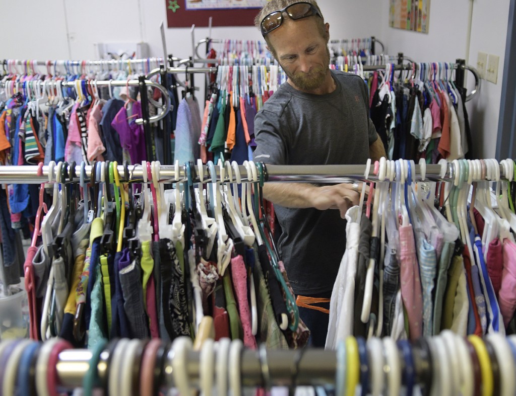 Joseph McKenna shops for clothing Thursday at Bridging the Gap, an Augusta nonprofit organization that oversees the Addie's Attic clothing bank, the Everyday Essentials toiletries pantry and, in the winter, the Augusta Community Warming Center.