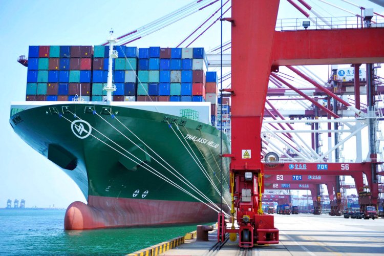 A container ship docks in the port of Qingdao in eastern China's Shandong province Friday,. The United States hiked tariffs on Chinese imports Friday and Beijing said it immediately retaliated. 