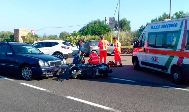 Ambulance personnel tend to George Clooney, who is lying on the ground, after he was involved in a scooter accident on the island of Sardinia, Italy, Tuesday.