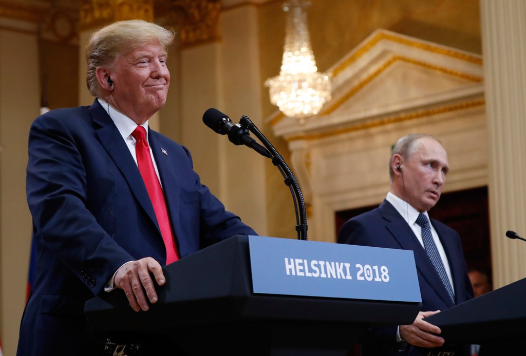 President Trump, shown at the news conference in Helsinki with Russian President Vladimir Putin on Monday, said Tuesday that he meant the opposite of what he said at the event, and that he should have said he doesn't see why Russia "wouldn't" be responsible for meddling in the 2016 election.