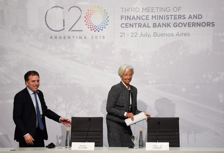 Christine Lagarde, International Monetary Fund managing director, and Argentina Treasury Minister Nicolas Dujovne arrive for a news conference during the G-20 meeting of finance ministers and Central Bank governors in Buenos Aires, Argentina, on Saturday. 