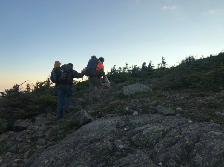 Emergency responders rescued Jennifer Custer, 38, of London, England, early Friday after she broke her ankle on Bigelow Mountain in Wyman Township. Custer is being carried up to the top of West Peak, which is 4,145 feet in elevation, to meet a Maine Forest Service helicopter. 