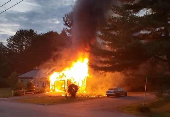The garage of the home on Rogers Road in Yarmouth burns Thursday night.