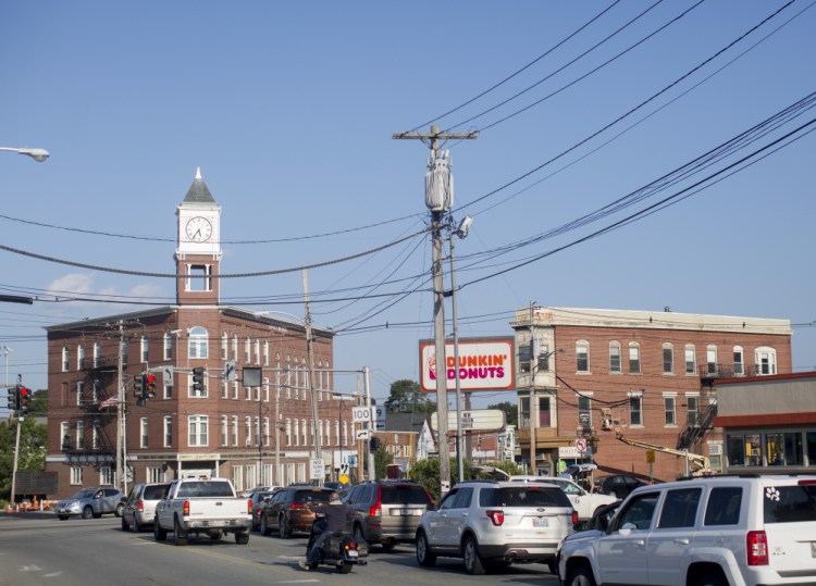 This view from Woodford Street shows Woodfords Corner, a five-way intersection, and its best-known landmark, the Odd Fellows Hall, at left with the clock tower.