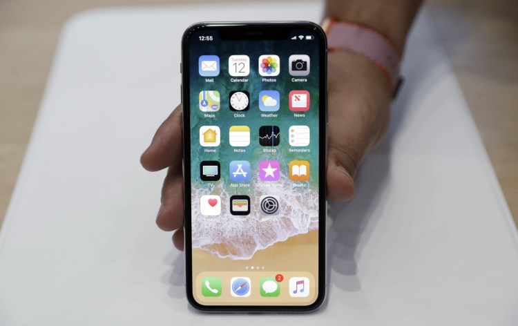 CEO Tim Cook told analysts that Apple is on track to meet a goal of doubling fiscal 2016 services revenue by 2020, most of them accessed through the popular iPhone, above.